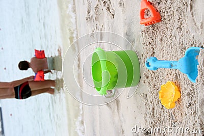 Child and toys on beach Stock Photo