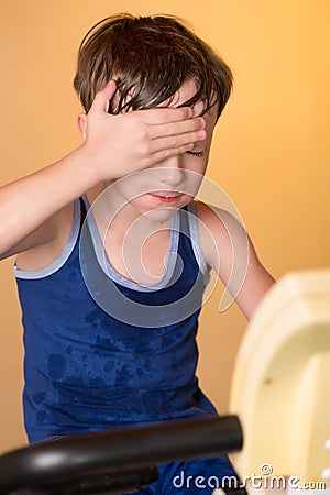 The child is trained on a stationary bike . Healthy lifestyle. Stock Photo