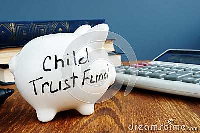 Child trust fund CTF written on a side of piggy bank Stock Photo