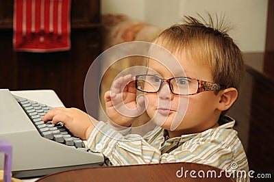 Child with typewriter Stock Photo