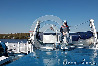 Child on upper deck of ship Stock Photo