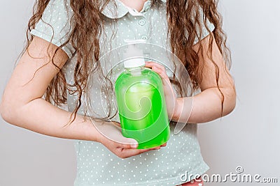 The child uses a hand antibacterial soap. Stock Photo