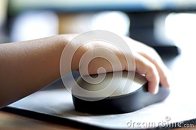 Child using computer mouse Stock Photo