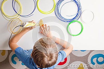 Child using 3d printing pen. Creative, technology, leisure, education concept Stock Photo