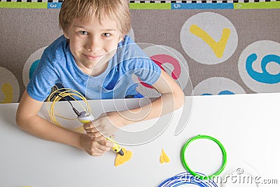 Child using 3D printing pen. Creative, technology, leisure, education concept Stock Photo