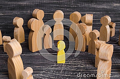 The child was lost in the crowd. A crowd of wooden figures Stock Photo