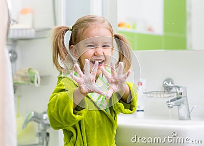 Child washing hands Stock Photo
