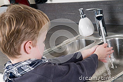 Child washing his hands Stock Photo