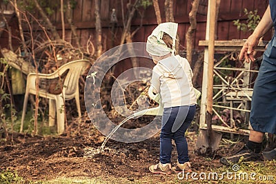 Child watering planted tree in garden save trees environmental conservation concept Stock Photo