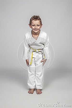 Child wearing martial arts judogi in the rei position Stock Photo