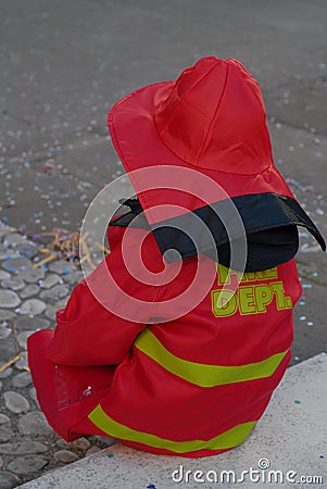 A child wears a firefighter costume Stock Photo