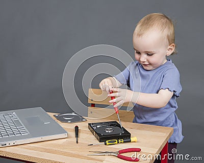 Child working at open hard drive Stock Photo