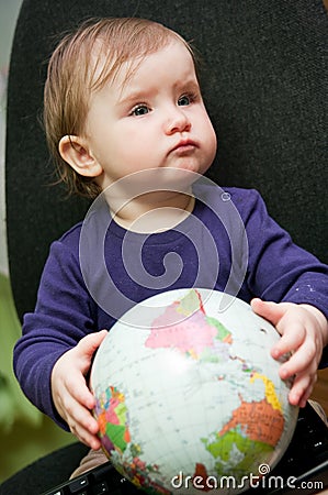 Child with world globe Stock Photo