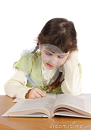 Child writes and reads,isolated. Stock Photo