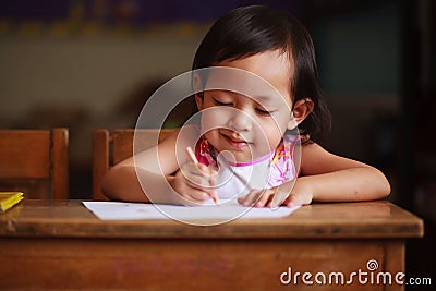 Child writing and smile Stock Photo