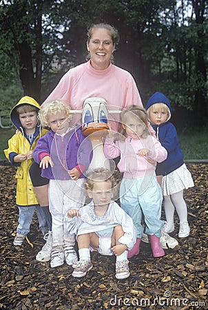 A childcare worker with her group of children Editorial Stock Photo