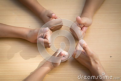 Childen asian people putting their hands together,teamwork with Stock Photo