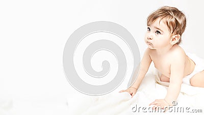Childhood, babyhood and people concept - little baby boy or girl crawling on floor at home Stock Photo