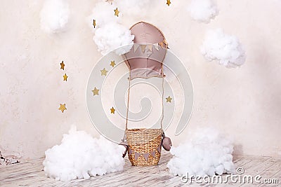 Childhood concept. Stylish vintage children`s room with a balloon, balloons and textile clouds. Interior of a children`s room for Stock Photo