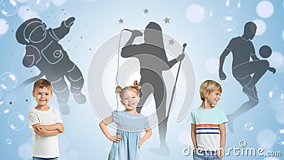 Little kids against silhouettes of spaceman, singer and soccer player Stock Photo