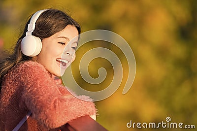 Childhood fun used to be carefree. Small child happy smiling on autumn day. Happy girl child. Childhood games during Stock Photo