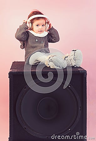 Childhood and happiness. kid listen music with headset and mp3 on phone. small happy girl. audio speaker. little girl Stock Photo