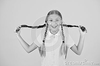 Childhood happiness. little girls in school uniform. retro look. children in vintage style play with pigtails. old Stock Photo