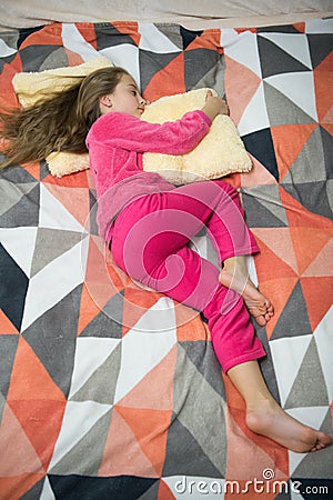 Childhood happiness. Little happy girl in bedroom. Good morning. International childrens day. Pajama party. Good night Stock Photo