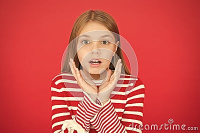 Childhood happiness. surprised little girl on red background. small girl child. School education. family and love Stock Photo