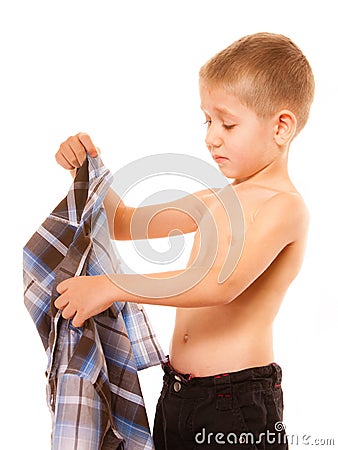 Childhood independence concept - little boy dressing up Stock Photo