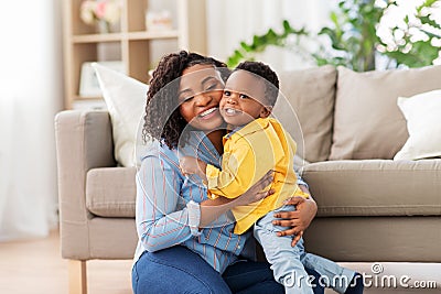 Happy african american mother with baby at home Stock Photo