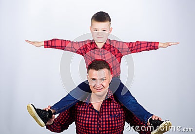 Childhood. parenting. fathers day. Enjoying time together. father and son in red checkered shirt. small boy with dad man Stock Photo