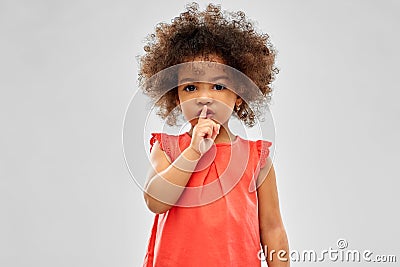 Little african american girl making shush gesture Stock Photo