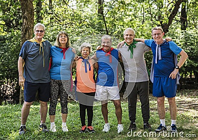 Childlike seniors wearing superhero costumes Stock Photo