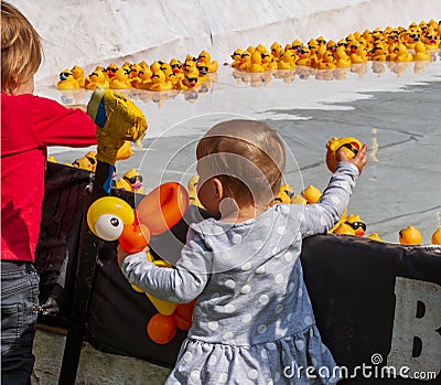 Children await the start of the Rubber Duck Race Editorial Stock Photo