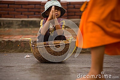 Children begging during the procession of local monks Editorial Stock Photo