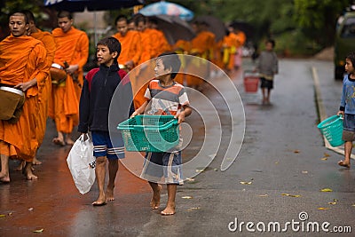 Children begging during the procession of local monks Editorial Stock Photo