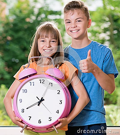 Children with big clock Stock Photo