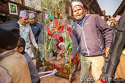 Children during Birthday celebration head of family - 77 years 7 months 7 days 7 hours old, like rebirth according to Newar. Editorial Stock Photo