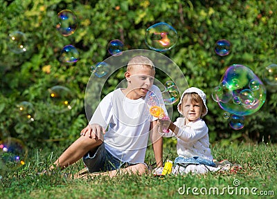 Children blow bubbles Stock Photo