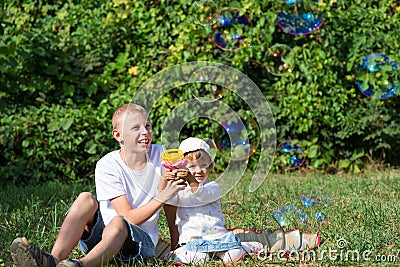 Children blow bubbles Stock Photo