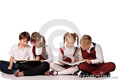 children with books siiting on the floor Stock Photo