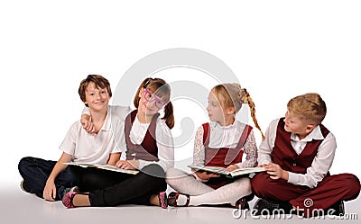 children with books siiting on the floor Stock Photo