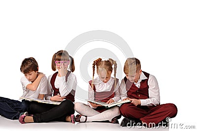 children with books siiting on the floor Stock Photo