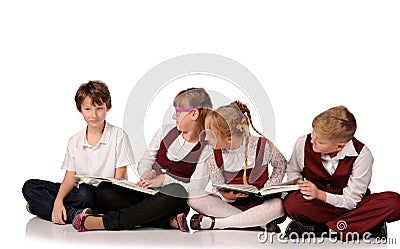 children with books siiting on the floor Stock Photo