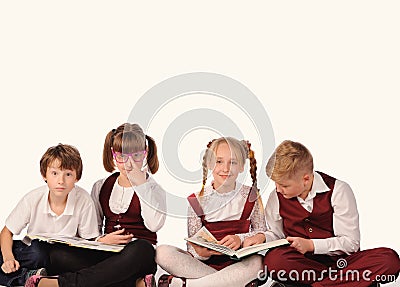 children with books siiting on the floor Stock Photo