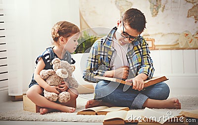 Children brother and sister, boy and girl reading a book Stock Photo