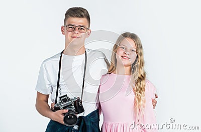children with camera. photographer. kids friendship concept. hobby. family day. teen boy and girl Stock Photo