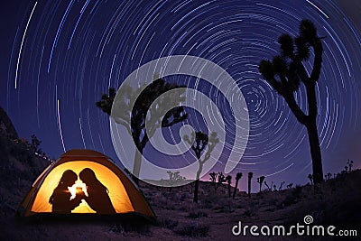 Children Camping at Night in a Tent Stock Photo