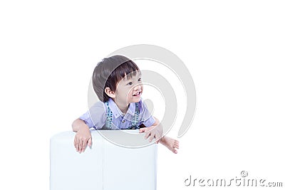 Children catch a chair and smile. Stock Photo